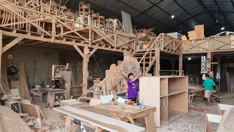Inside Bali Best Buy workshop showing mass production of custom teak furniture